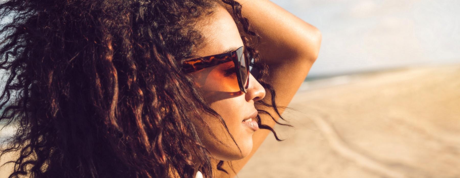 a woman with her hair blowing in the wind
