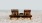 a couple of benches sit on a beach
