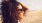 a woman with her hair blowing in the wind